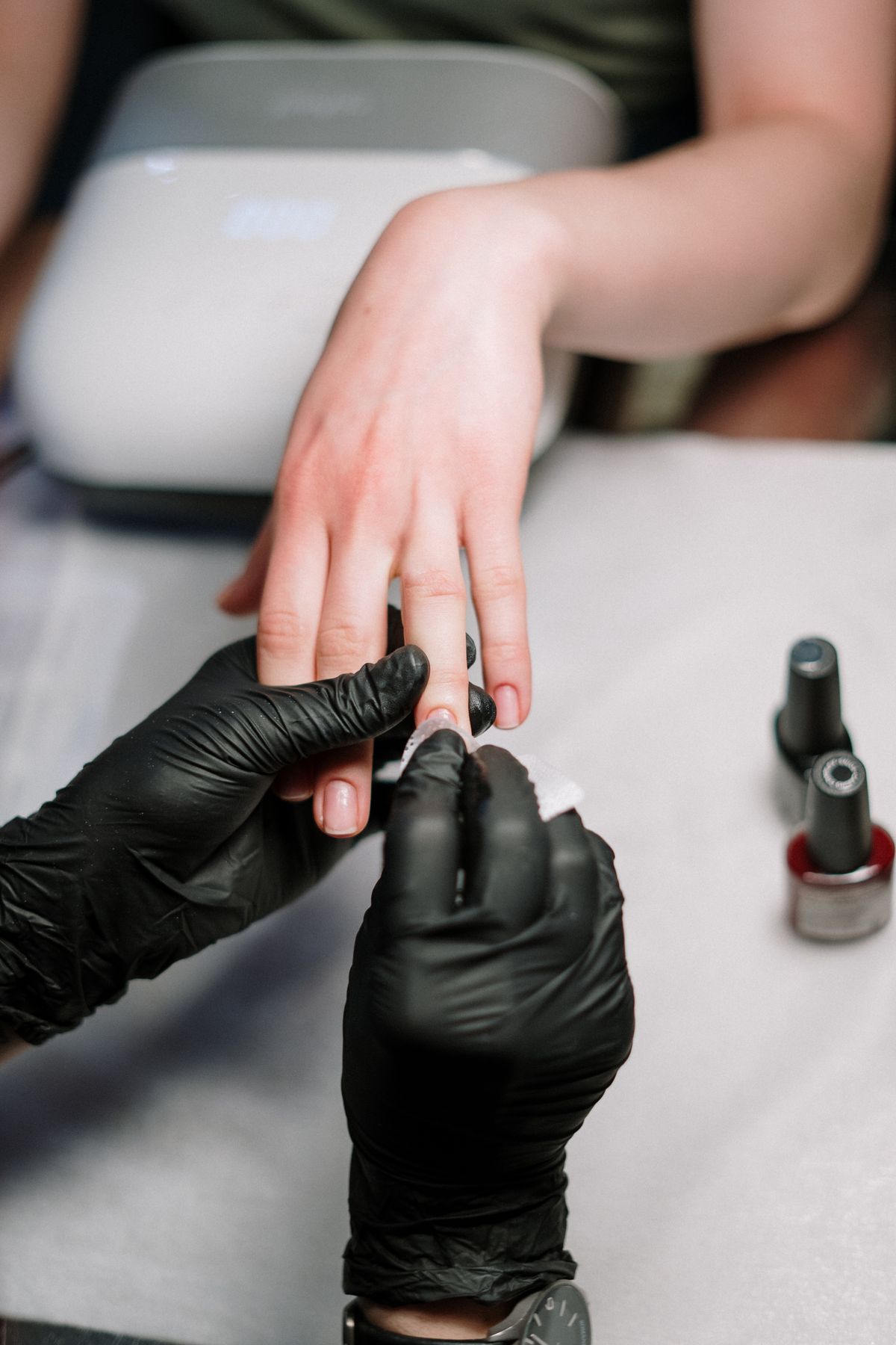 Manicure being finished at Tip Top Nails